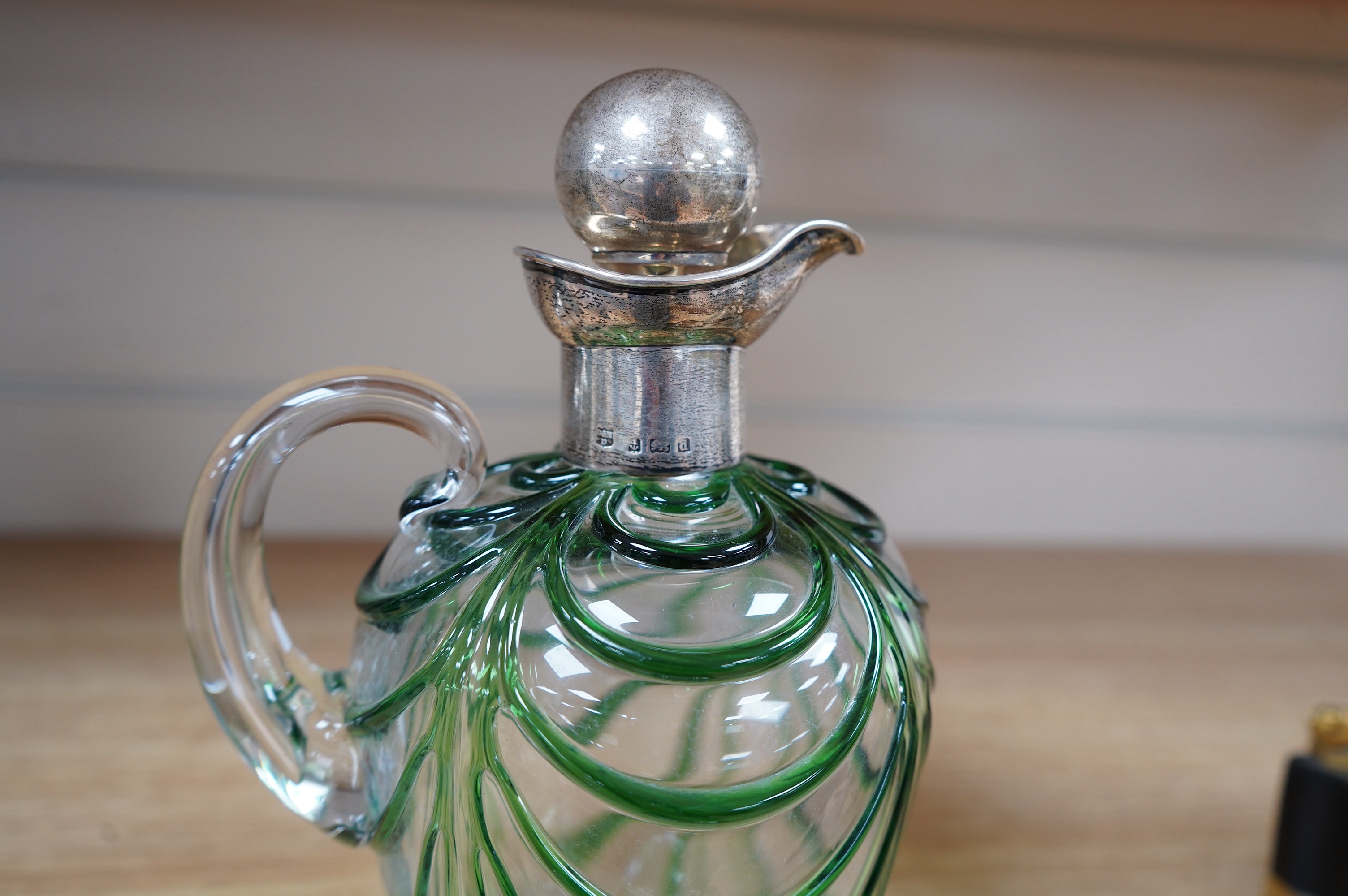 An Art Nouveau silver mounted green overlaid glass liqueur jug, David & Maurice Davis, Birmingham 1904, 20cm high. Condition - good